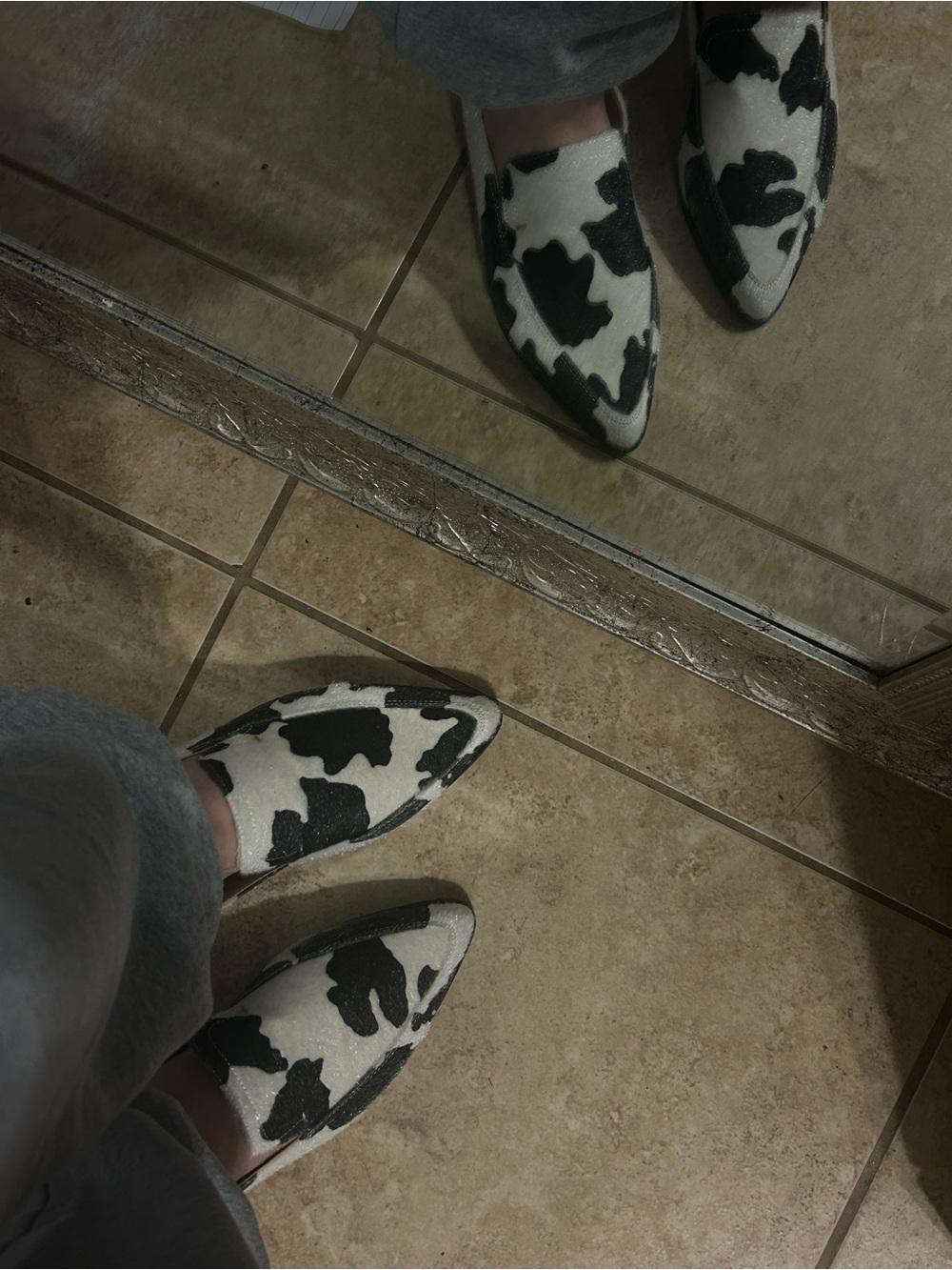 Black & White Cow Print Slip-On Women's Loafers